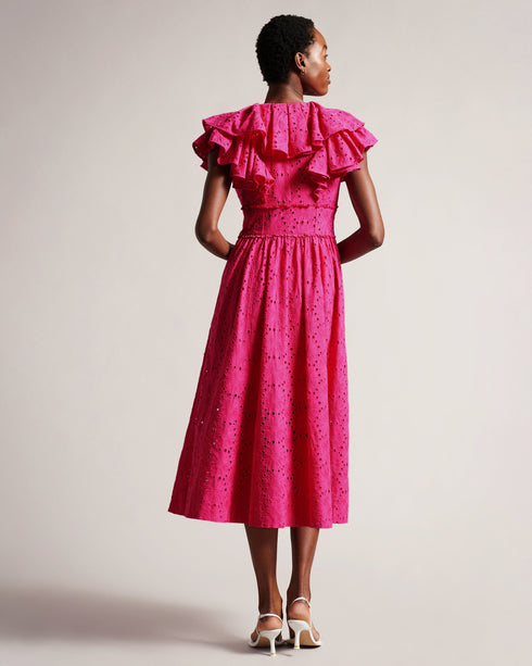 MIRZA-Dresses-Every day is a fashion show in MIRZA. Featuring a delicate broderie design and playful ruffles, this midi dress was made for strutting your stuff through the bustling city streets. Whether you're sipping lattes at a chic café, indulging in retail therapy, or embarking on a romantic rendezvous, this dress guarantees an unforgettable entrance.The fabric of this product is made of 100% organic cotton. Organic cotton has a proven lower environmental impact than conventional cotton, as it reduces